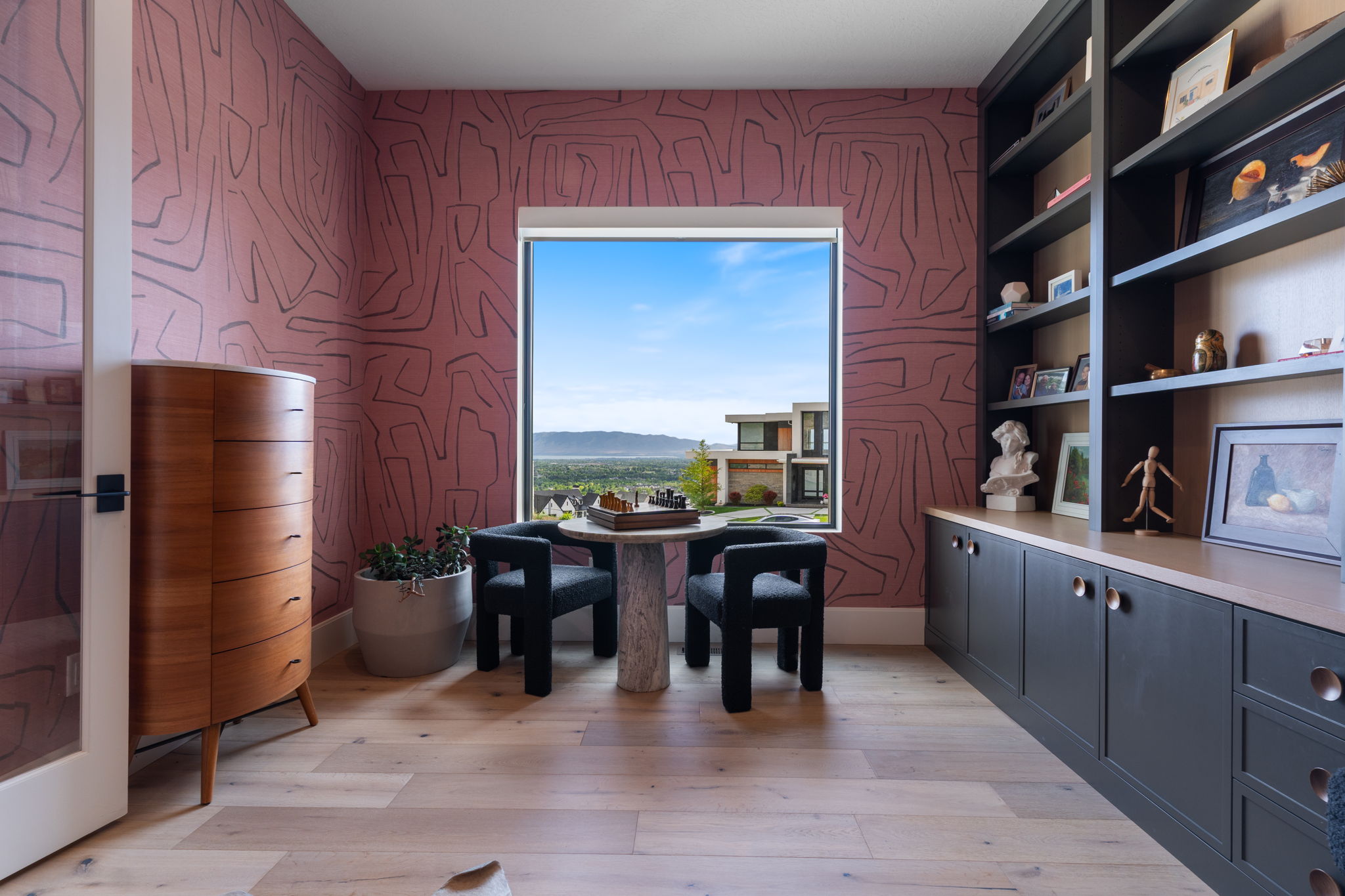 Expansive window framing distant mountains