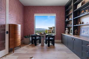 Expansive window framing distant mountains