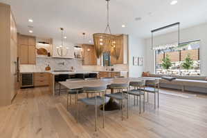 Open-concept living area featuring wide-plank wood-finish flooring