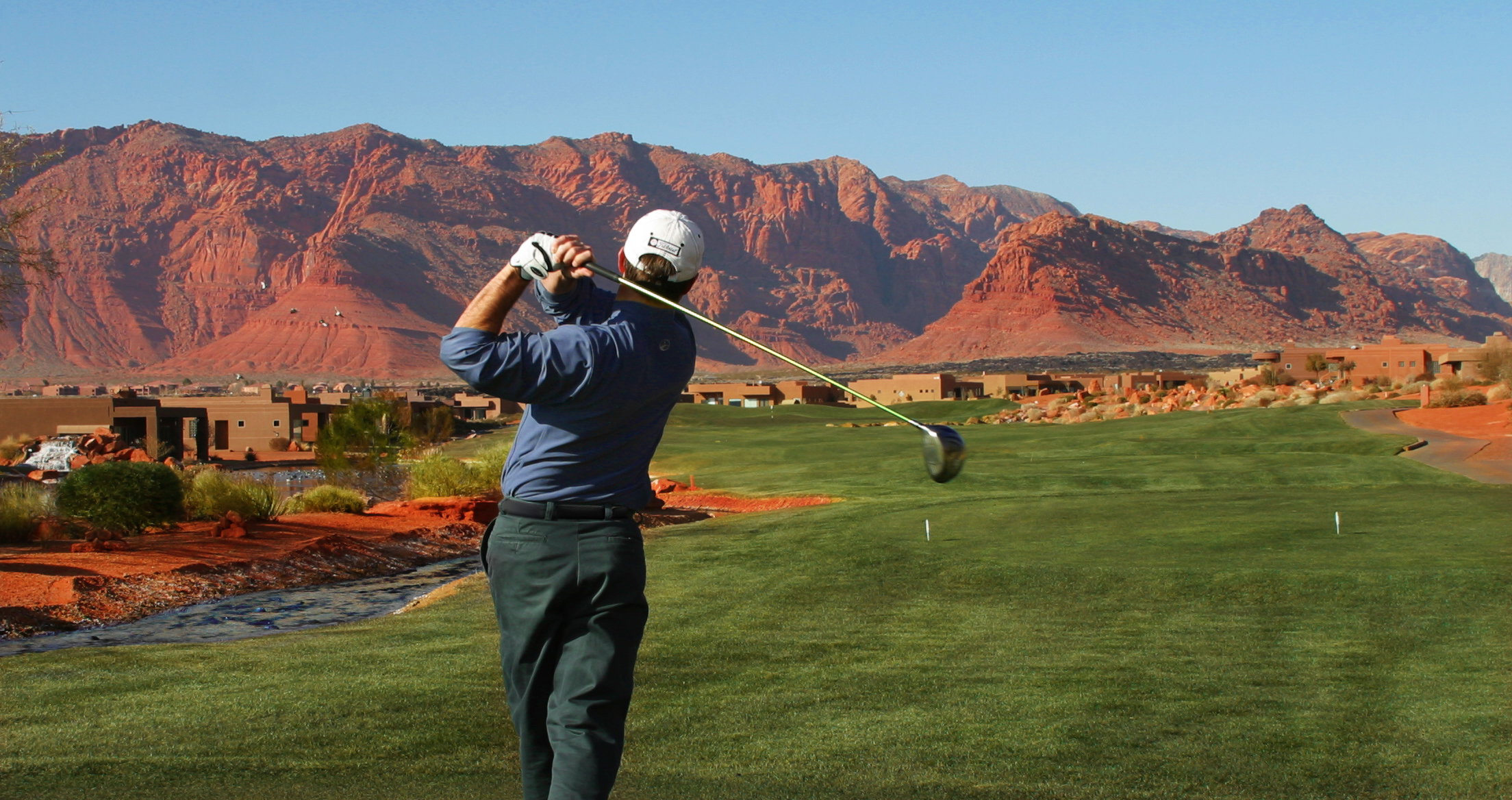Golf course setting with manicured greens and natural desert landscaping