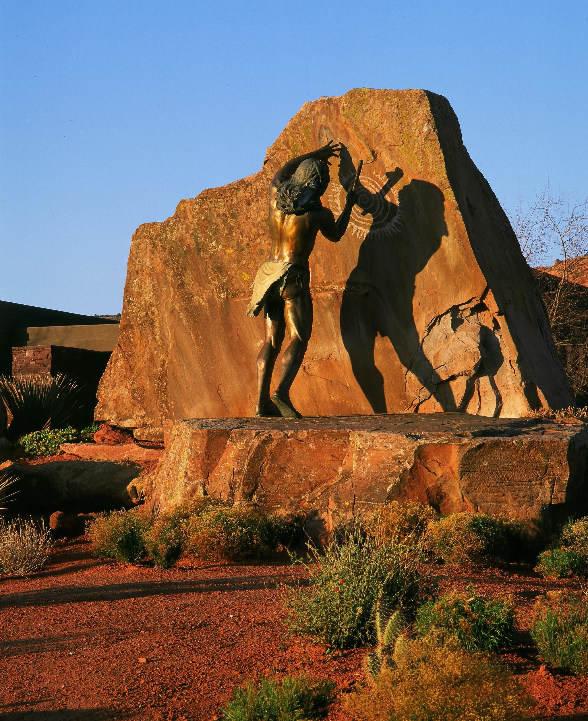 Bronze sculpture on a substantial natural rock formation