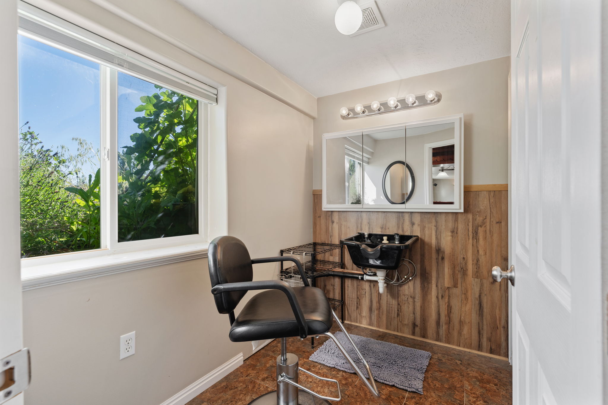Beauty Salon with shampoo sink.