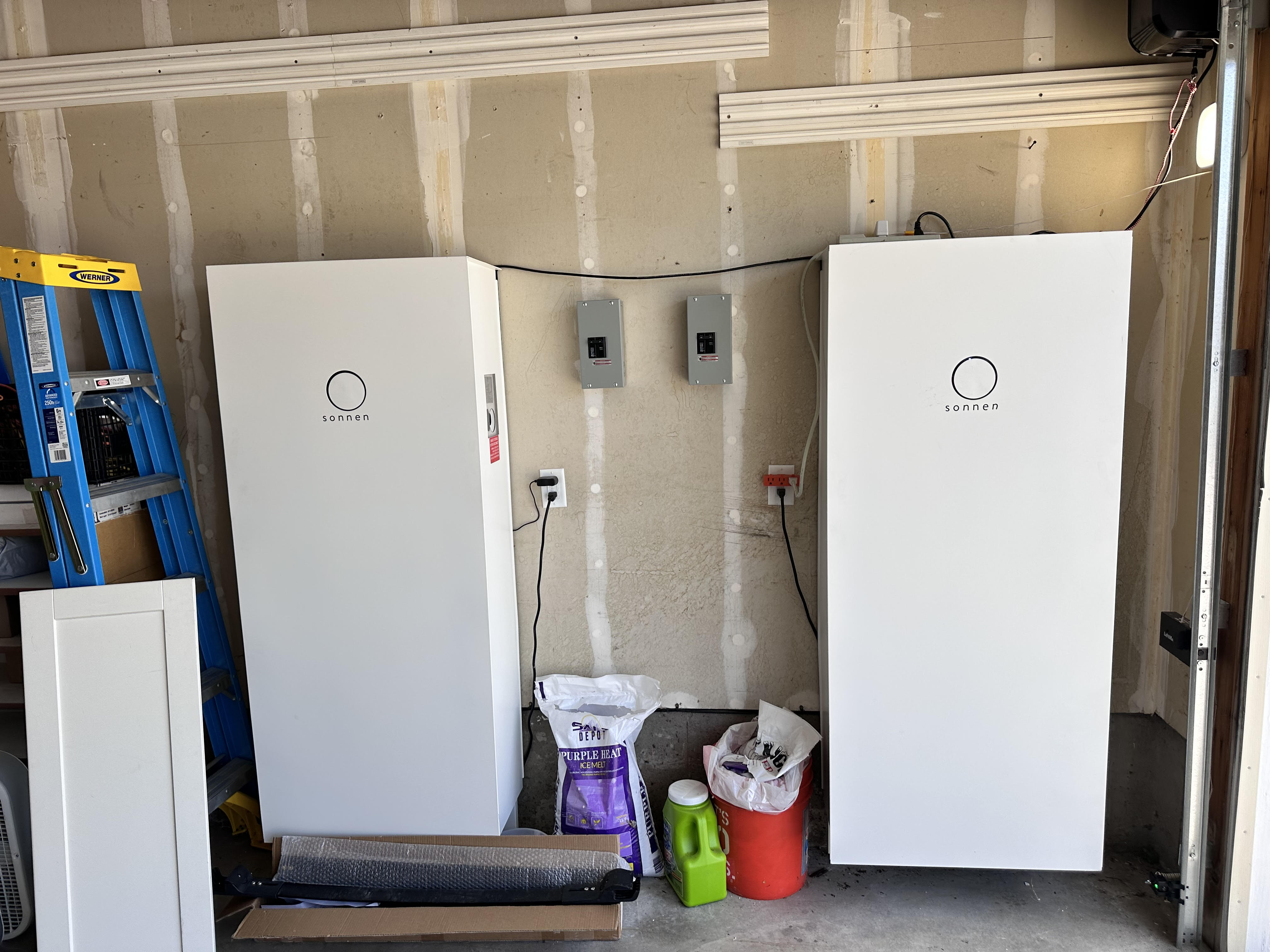 Dual energy storage systems featuring two white SONNEN battery units and dedicated electrical panels