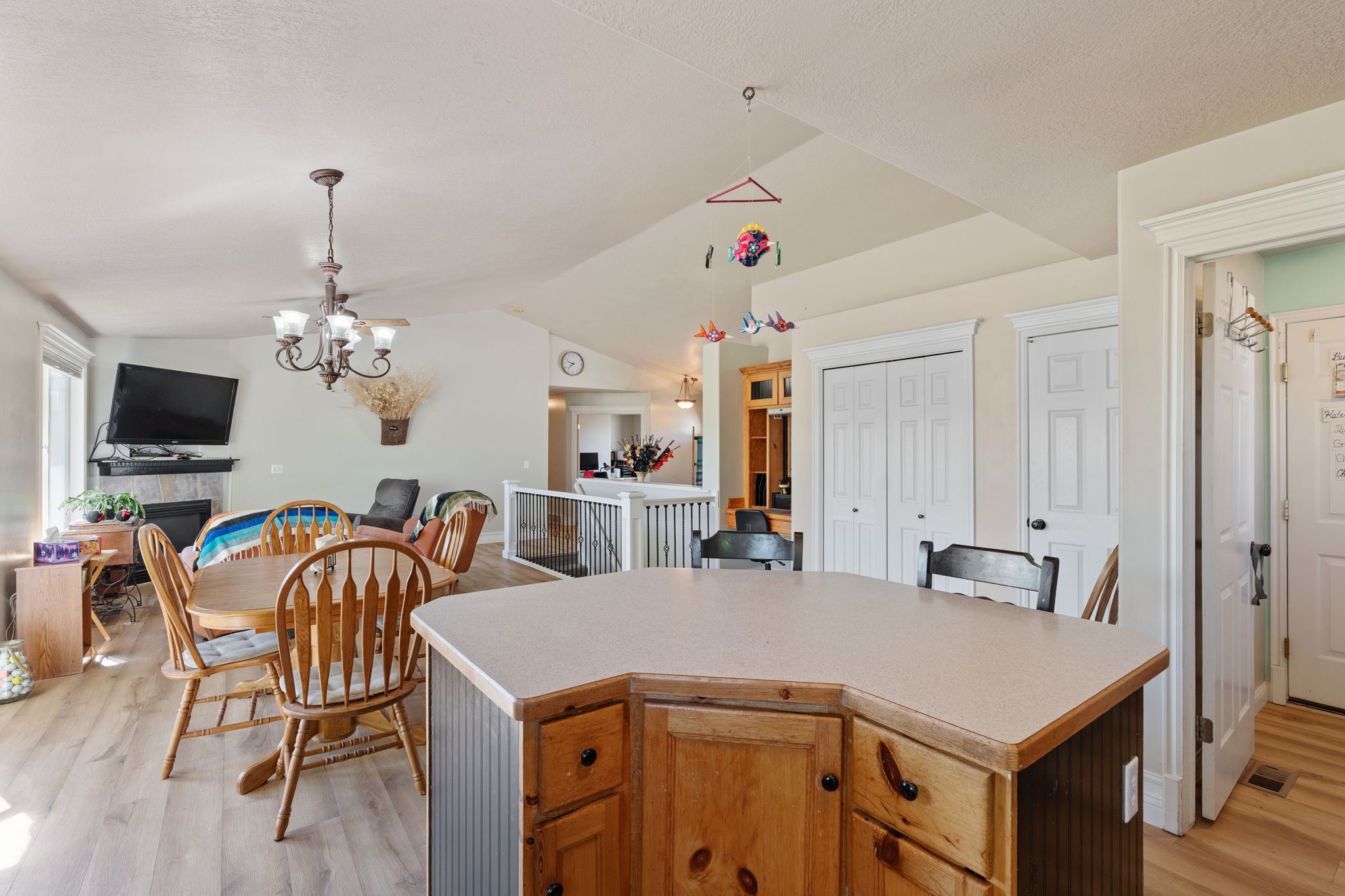 Kitchen island with light-toned countertop and wood-finish cabinetry