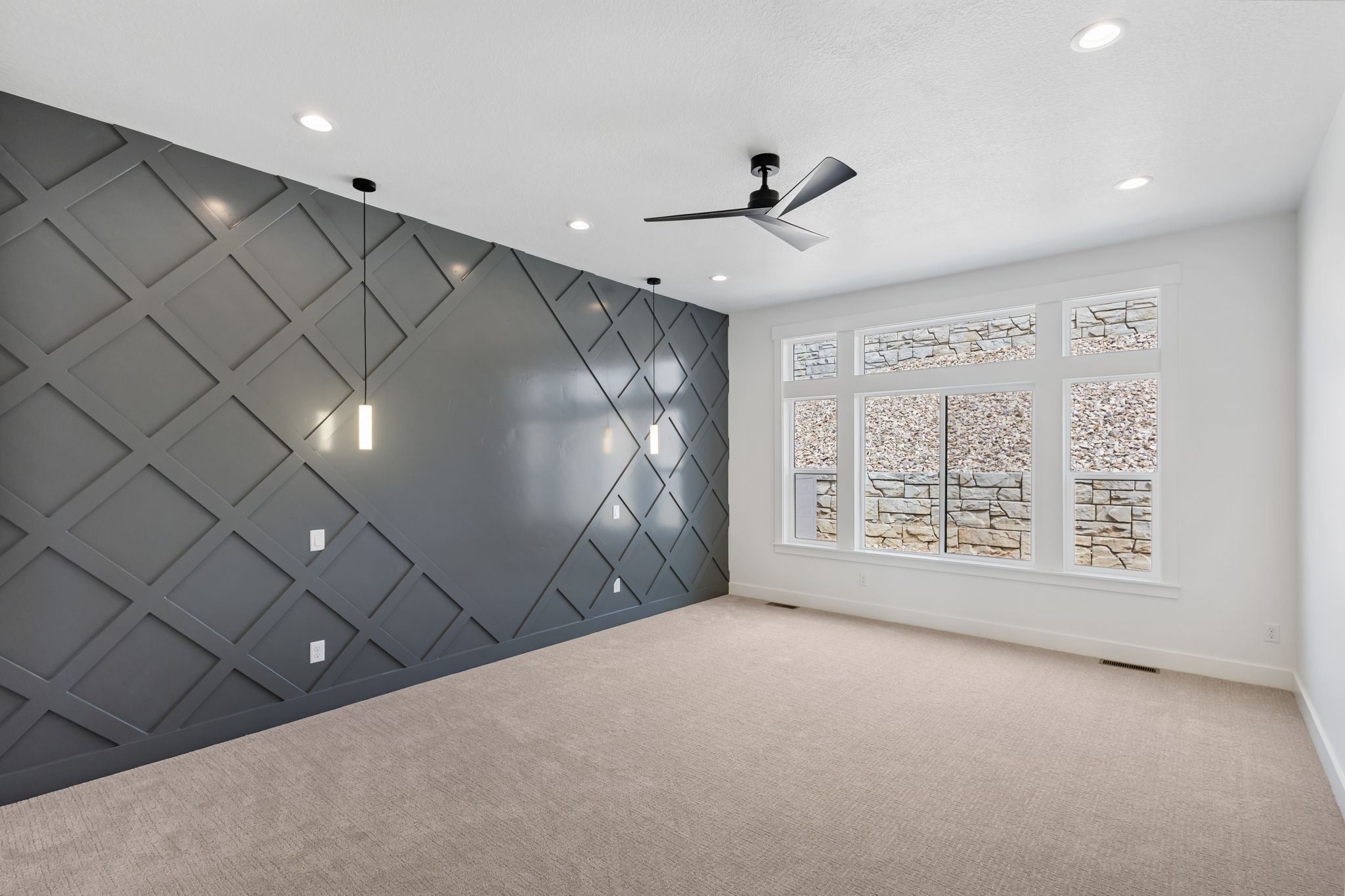 Primary bedroom with accent wall.