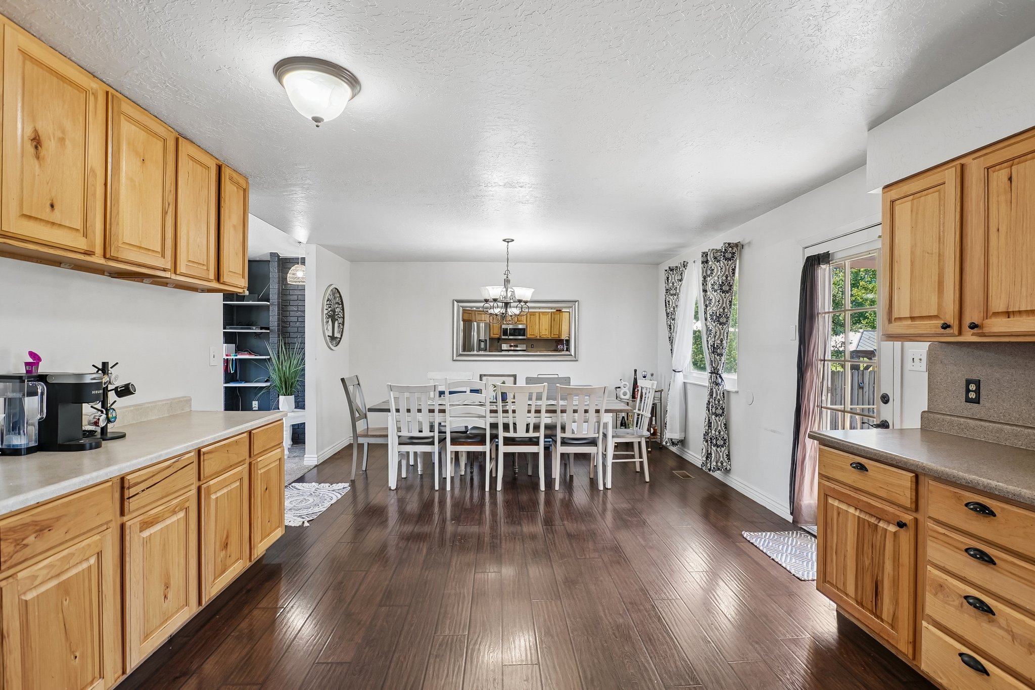 Open concept living space featuring rich wood-finish flooring