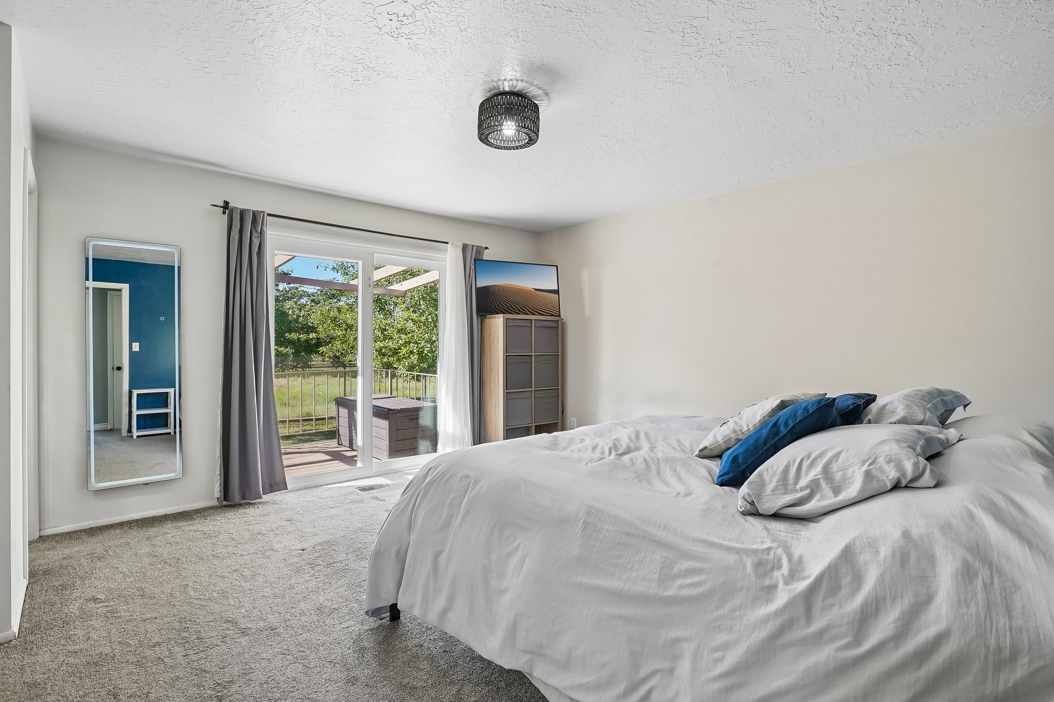 Bedroom featuring light-toned carpeting and neutral wall tones