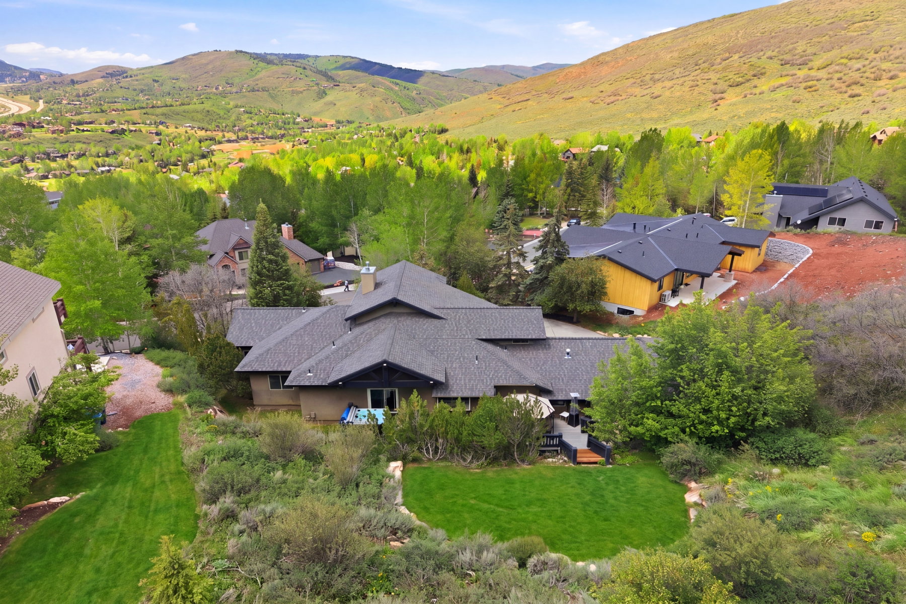 Contemporary residence featuring multiple rooflines and a stucco exterior