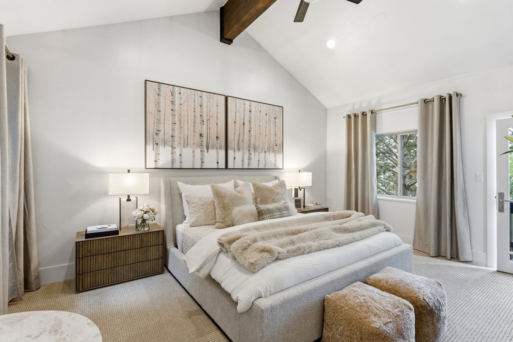 Vaulted ceiling with exposed wood beam and ceiling fan