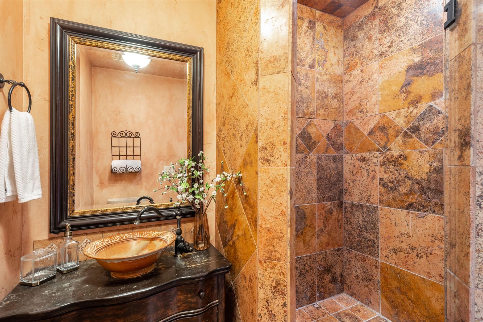 Custom-tiled shower with decorative accent border