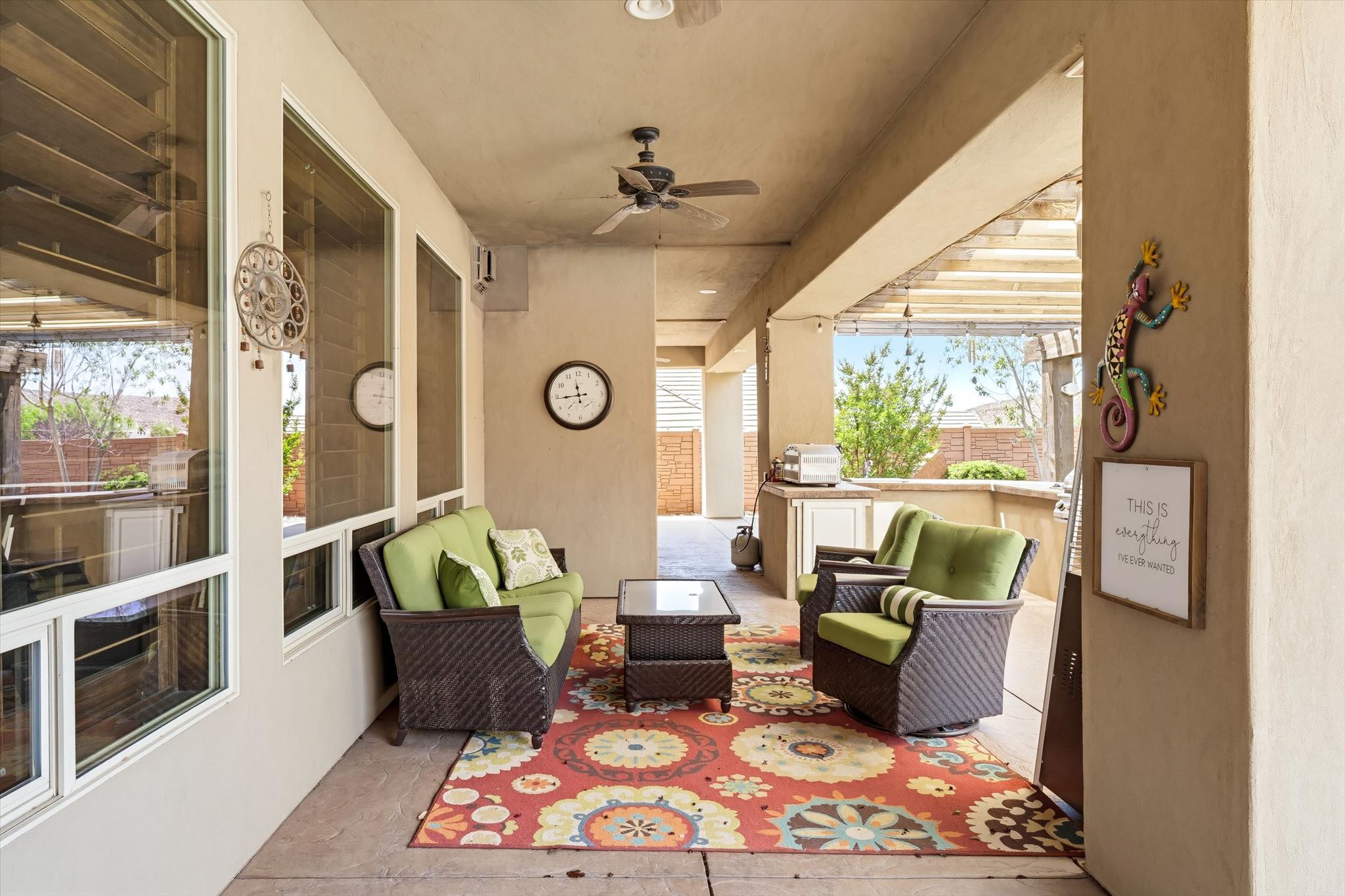 Covered patio featuring an outdoor kitchen with countertop space, recessed lighting, and a ceiling fan
