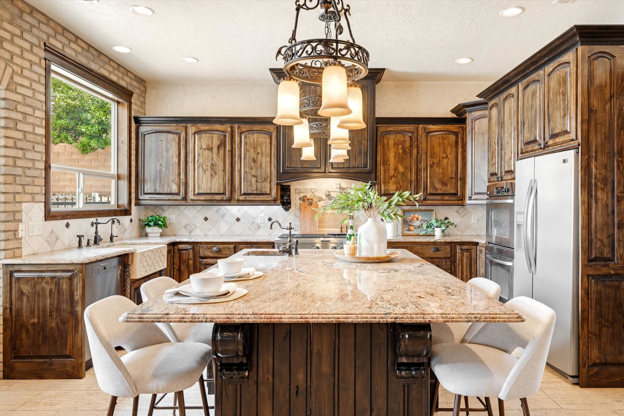 Kitchen island featuring a granite countertop with seating, complemented by custom wood cabinetry