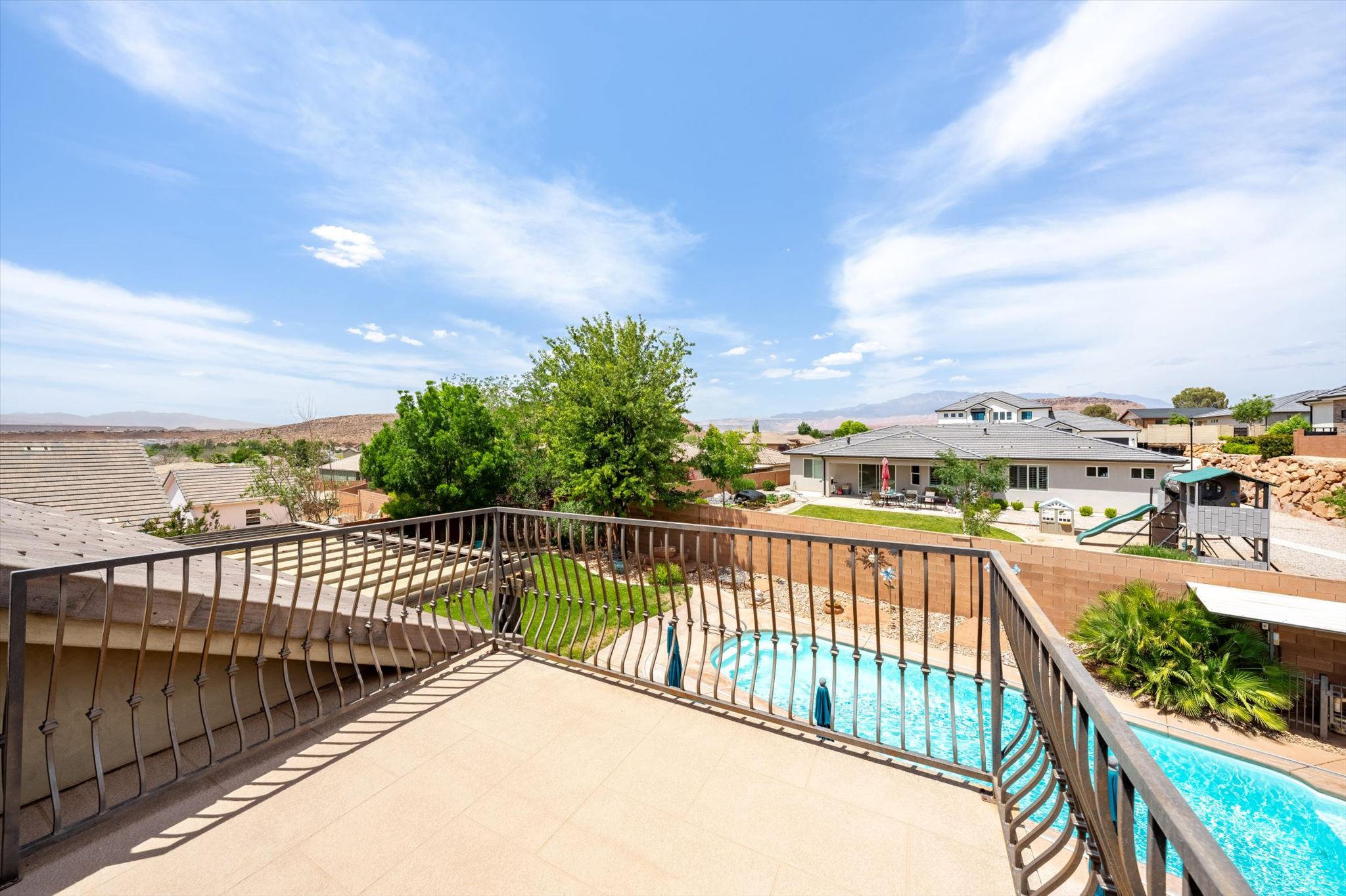 Spacious private balcony featuring decorative metal railings