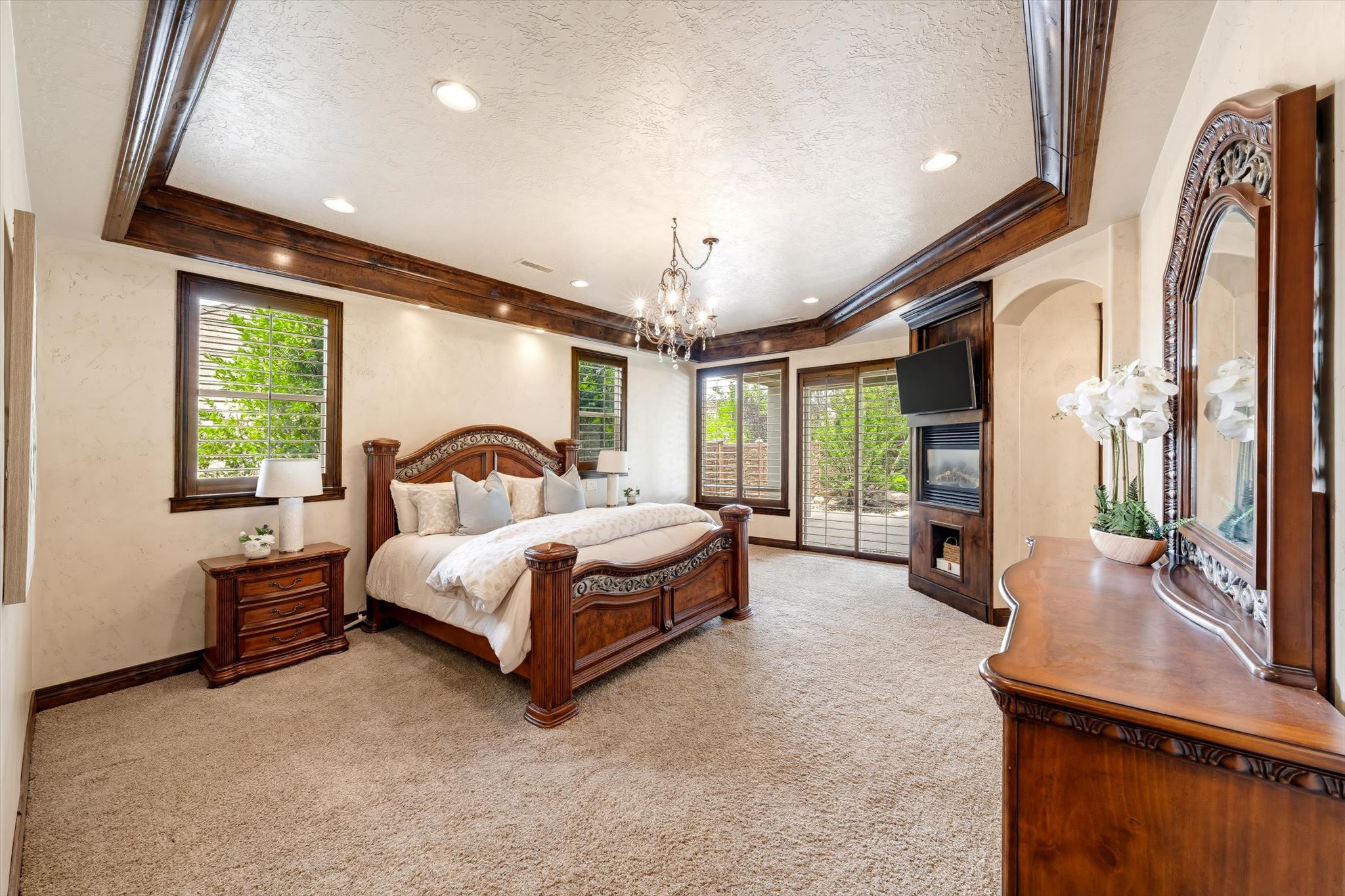 Recessed ceiling with decorative wood beams and integrated lighting