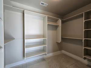 Built-in closet system featuring multiple shelving units and hanging rods