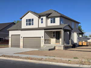 Two-story exterior featuring a stone and board and batten facade