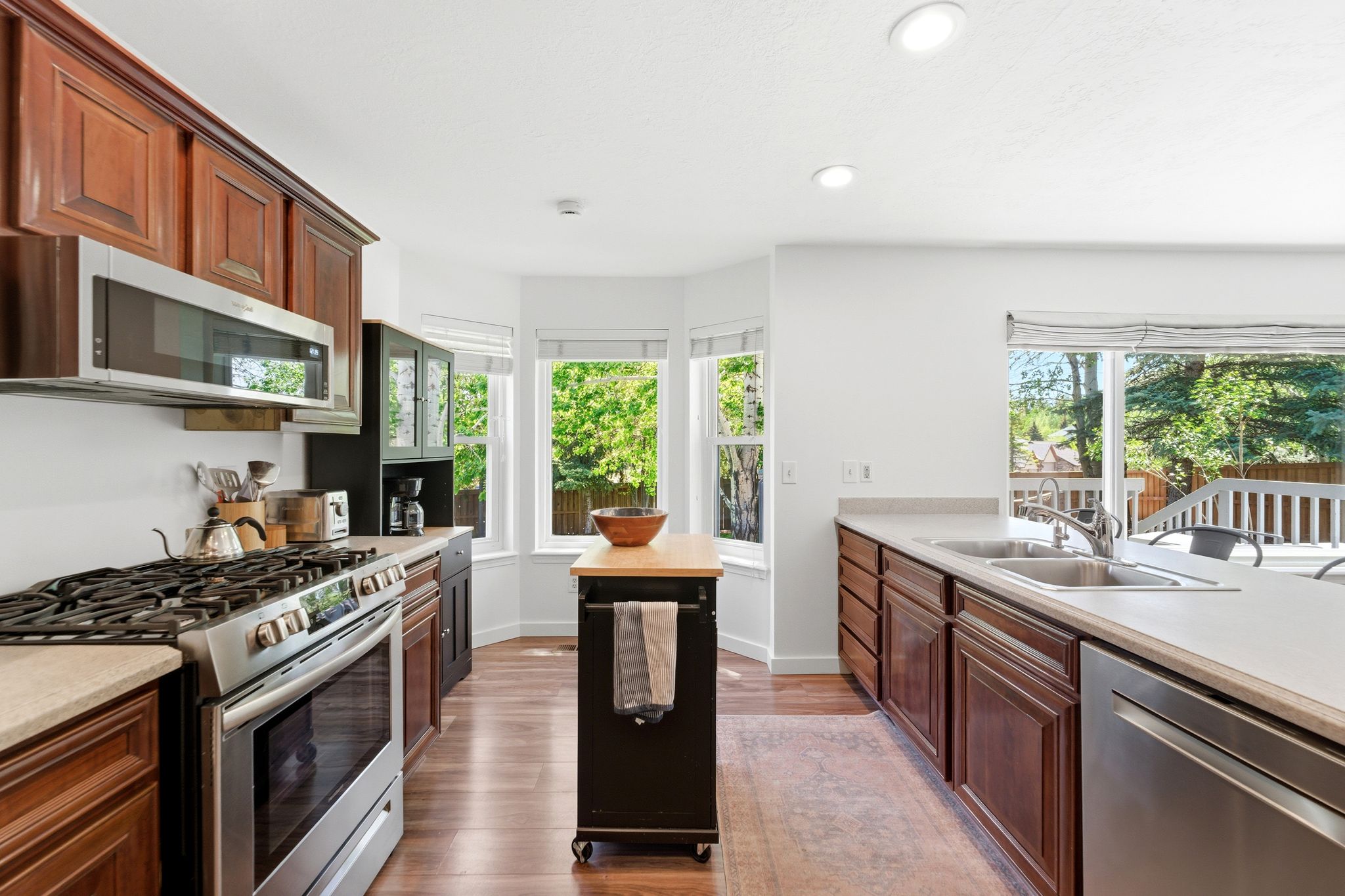Kitchen featuring LVP flooring, recessed lighting, and a bay window