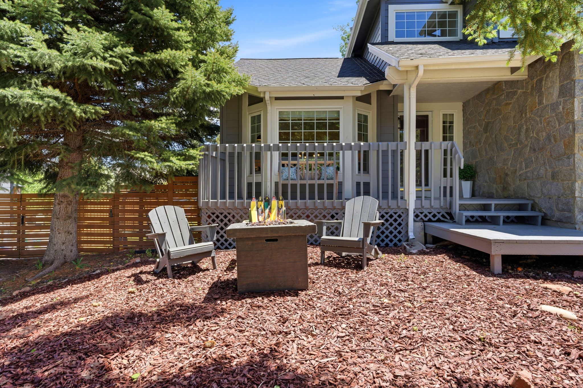 Cozy seating area in front yard near the front porch