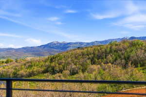 Expansive mountain scenery with distant peaks and rolling hillsides