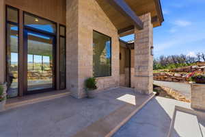 Stone veneer exterior featuring a prominent structural beam