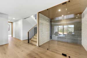Contemporary interior featuring light wood-finish flooring throughout