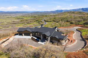 Contemporary home exterior featuring stone accents and dark siding