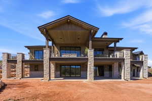 Multi-level modern home featuring extensive stone and wood siding