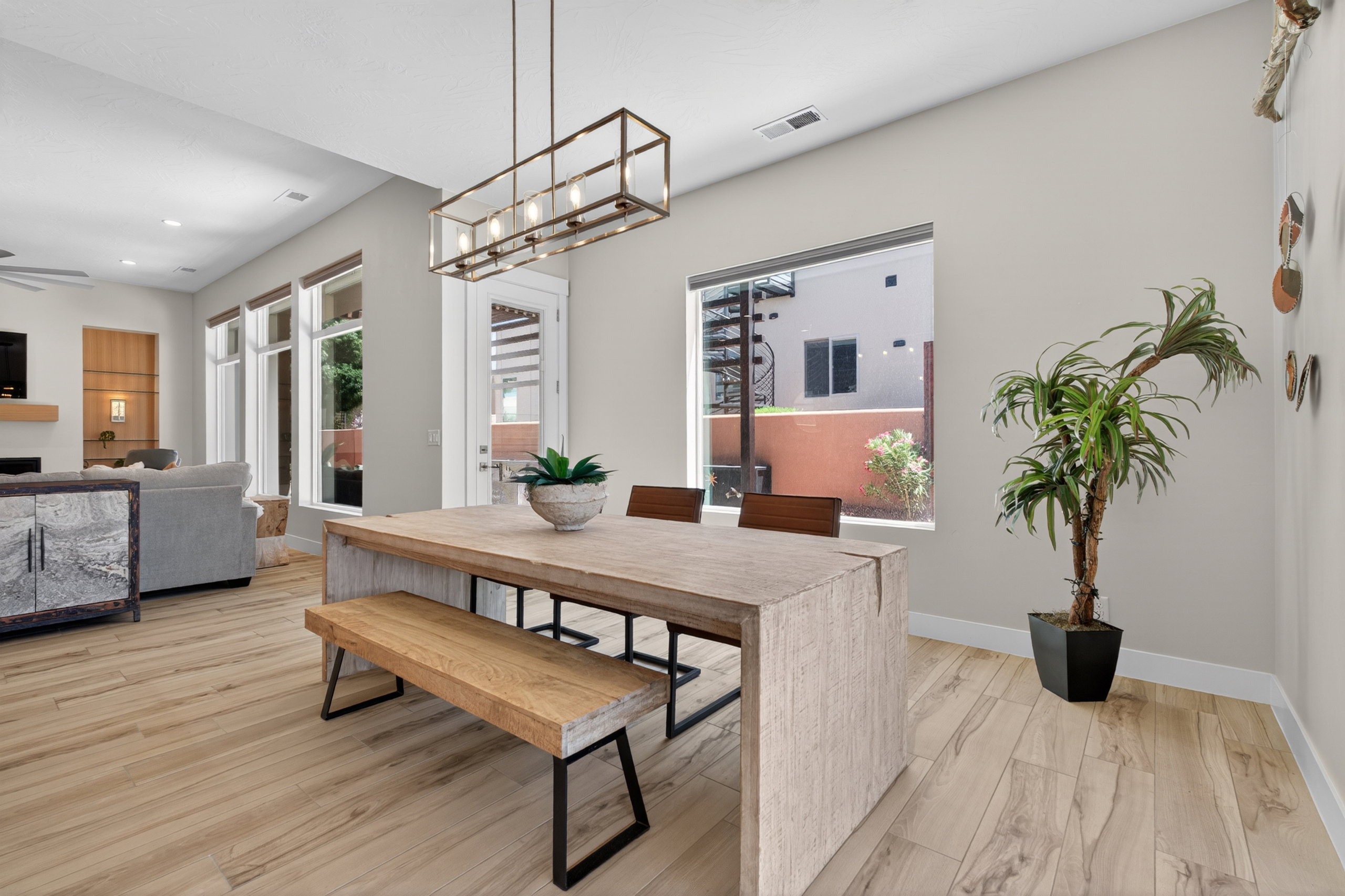 Spacious dining area featuring wood-finish tile flooring and a rectangular window