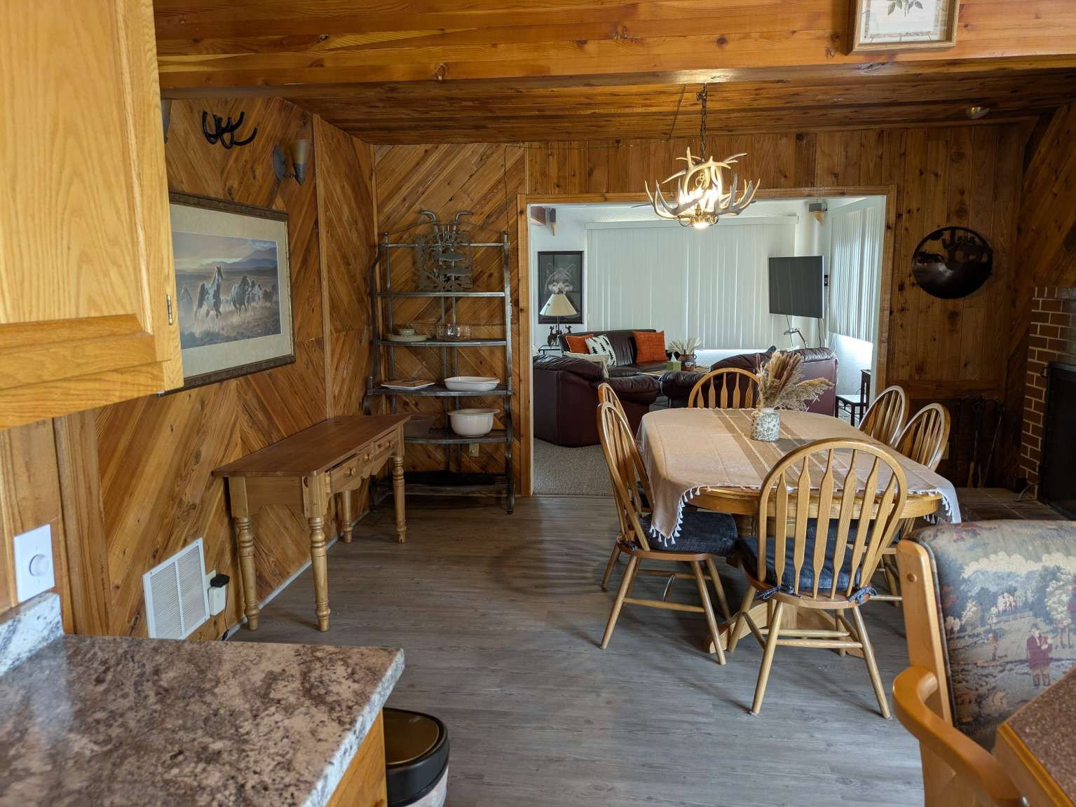 Dining area featuring wood-finish walls and ceiling