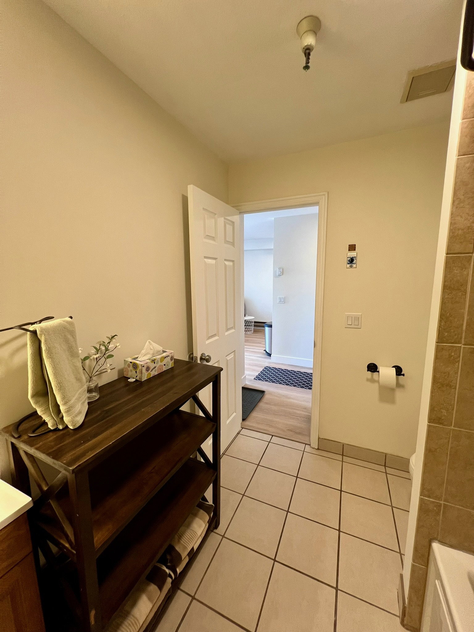 Light-toned tile flooring in a bathroom space