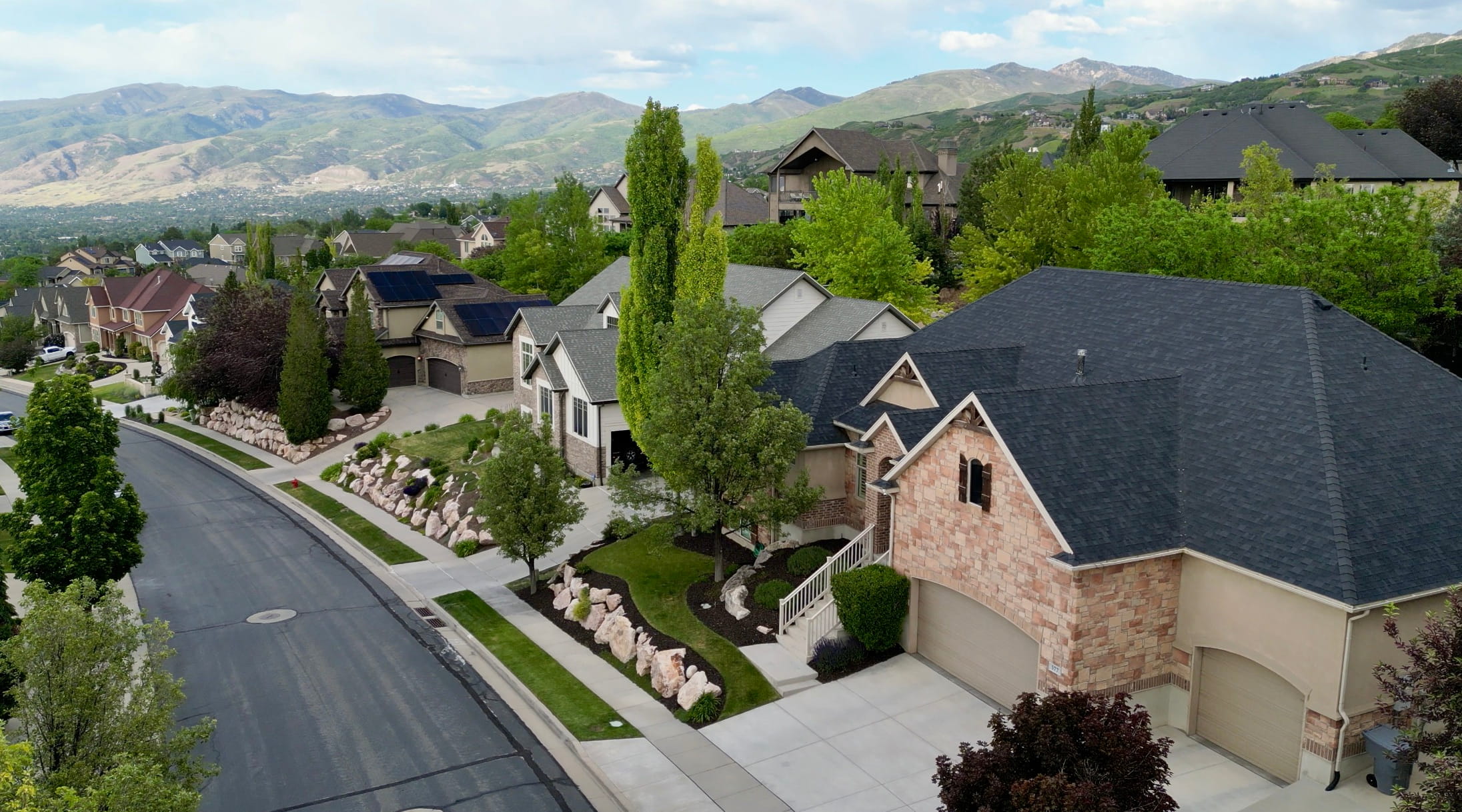 Located in one of the area's most desirable luxury neighborhoods, this beautifully landscaped property offers outstanding curb appeal, generous setbacks, and a private setting framed by mature trees and custom rock landscaping.