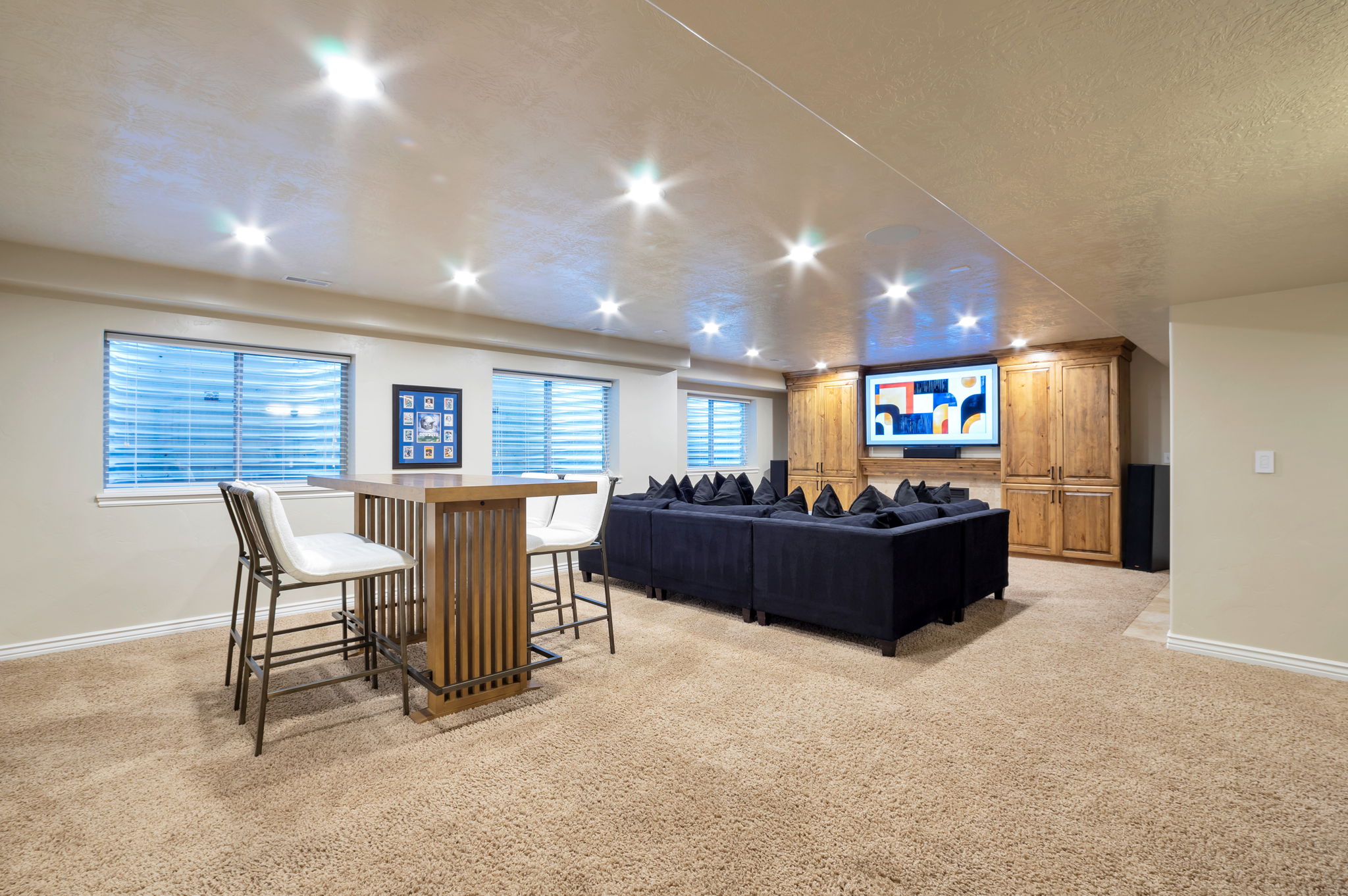 Massive lower-level living area designed for movie nights, game days, and entertaining.