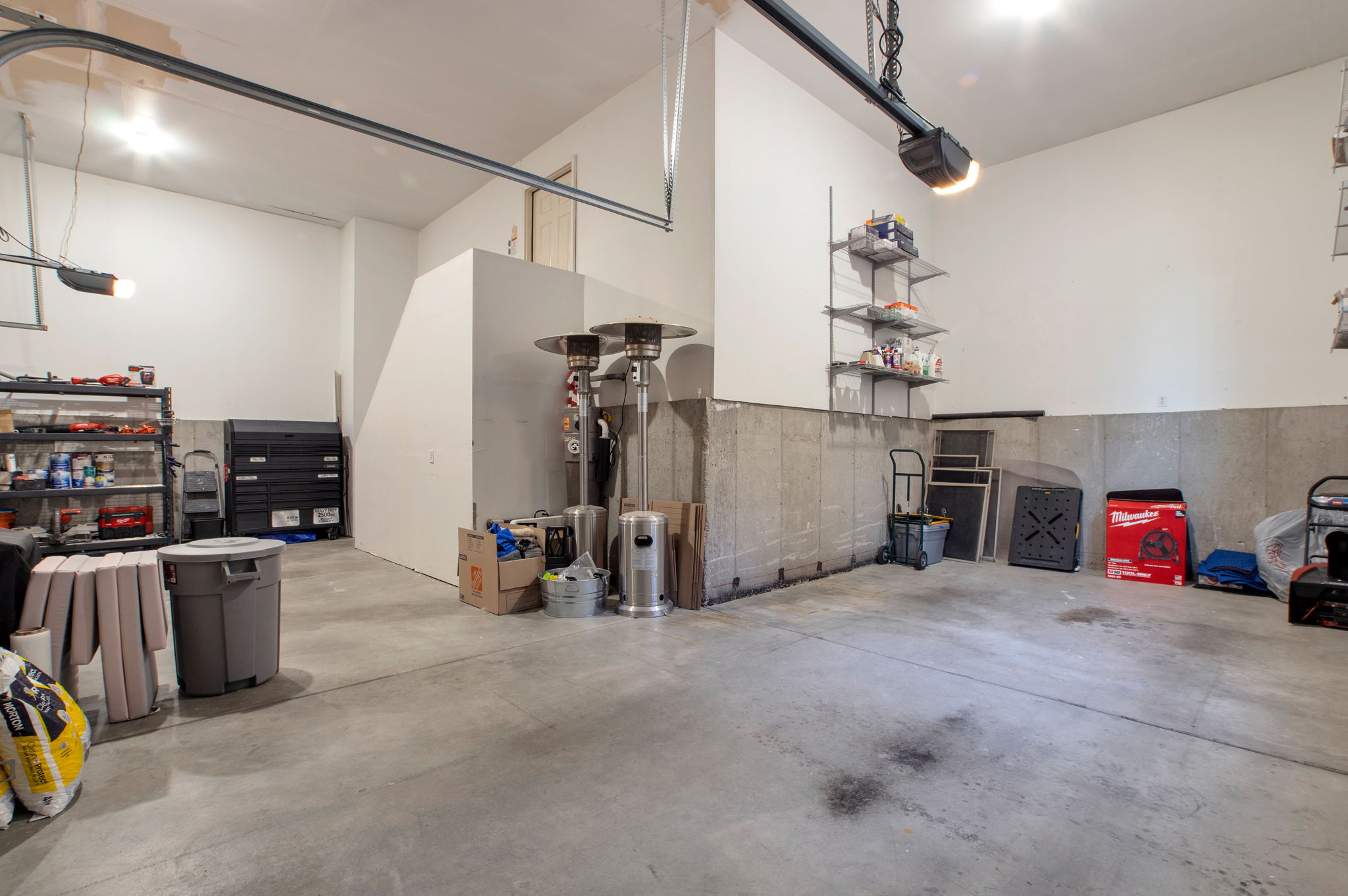 Oversized garage offering incredible flexibility for storage, projects, and oversized vehicles.