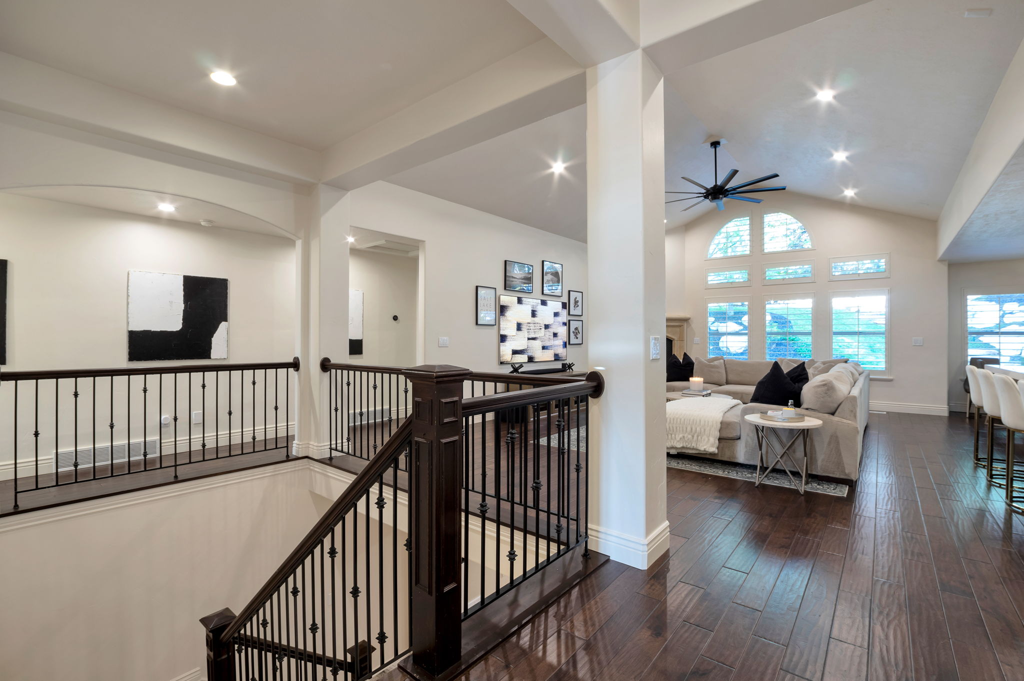 Grand foyer with soaring ceilings, rich hardwood flooring, and open sightlines that immediately showcase the home's spacious design.