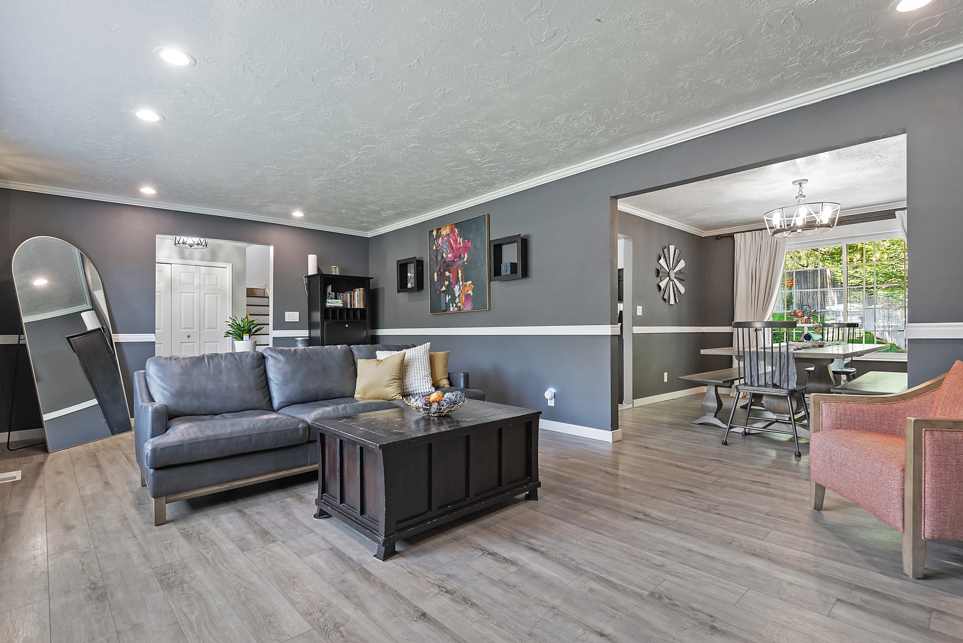 Expansive interior living space featuring light wood-finish flooring