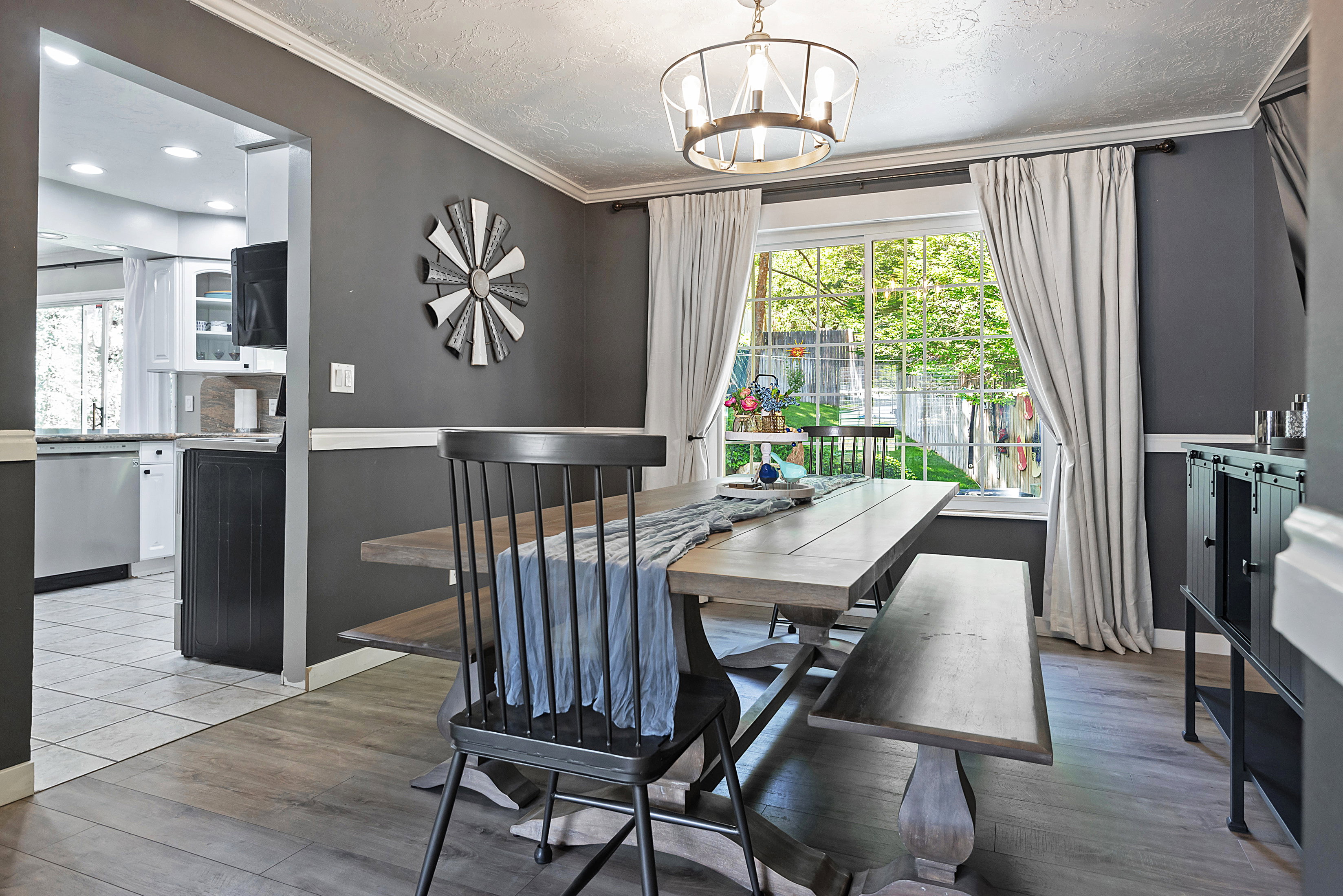 Dining area featuring wood-finish flooring and a central window