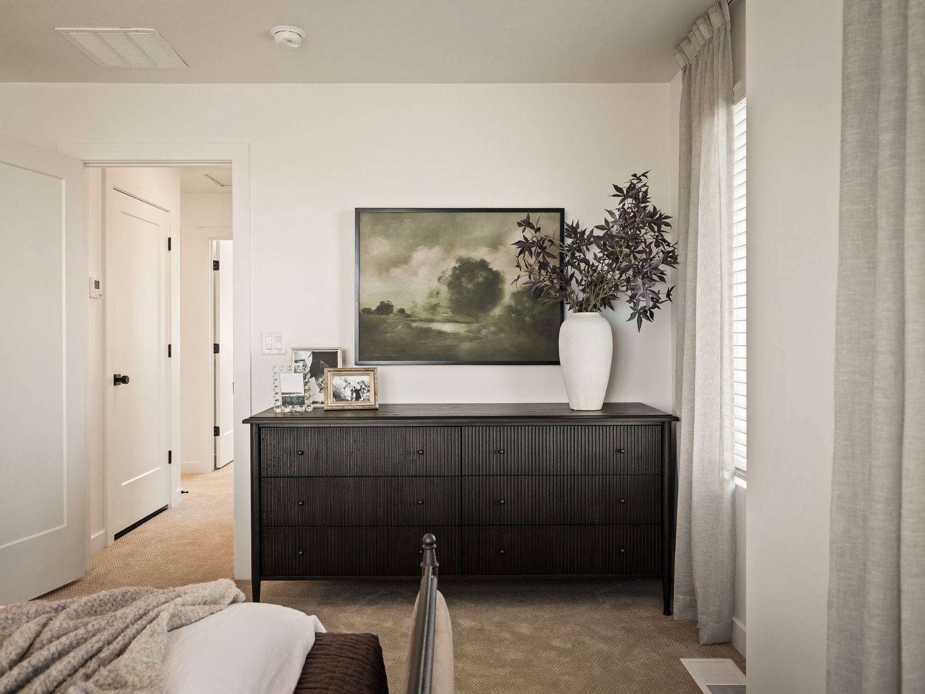 Neutral wall paint paired with light-colored carpeting