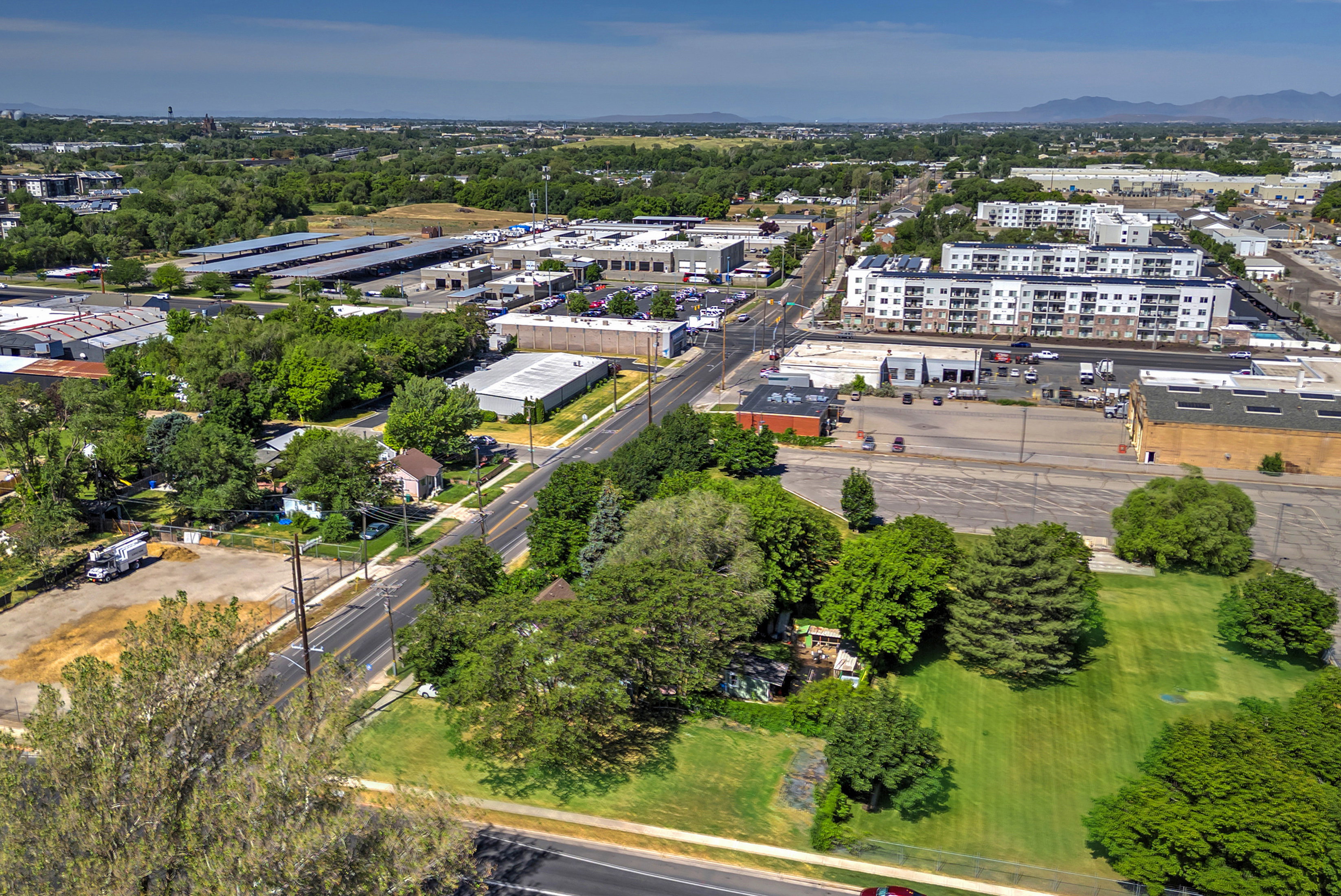 Aerial perspective showcasing a mixed-use neighborhood with residential and commercial properties