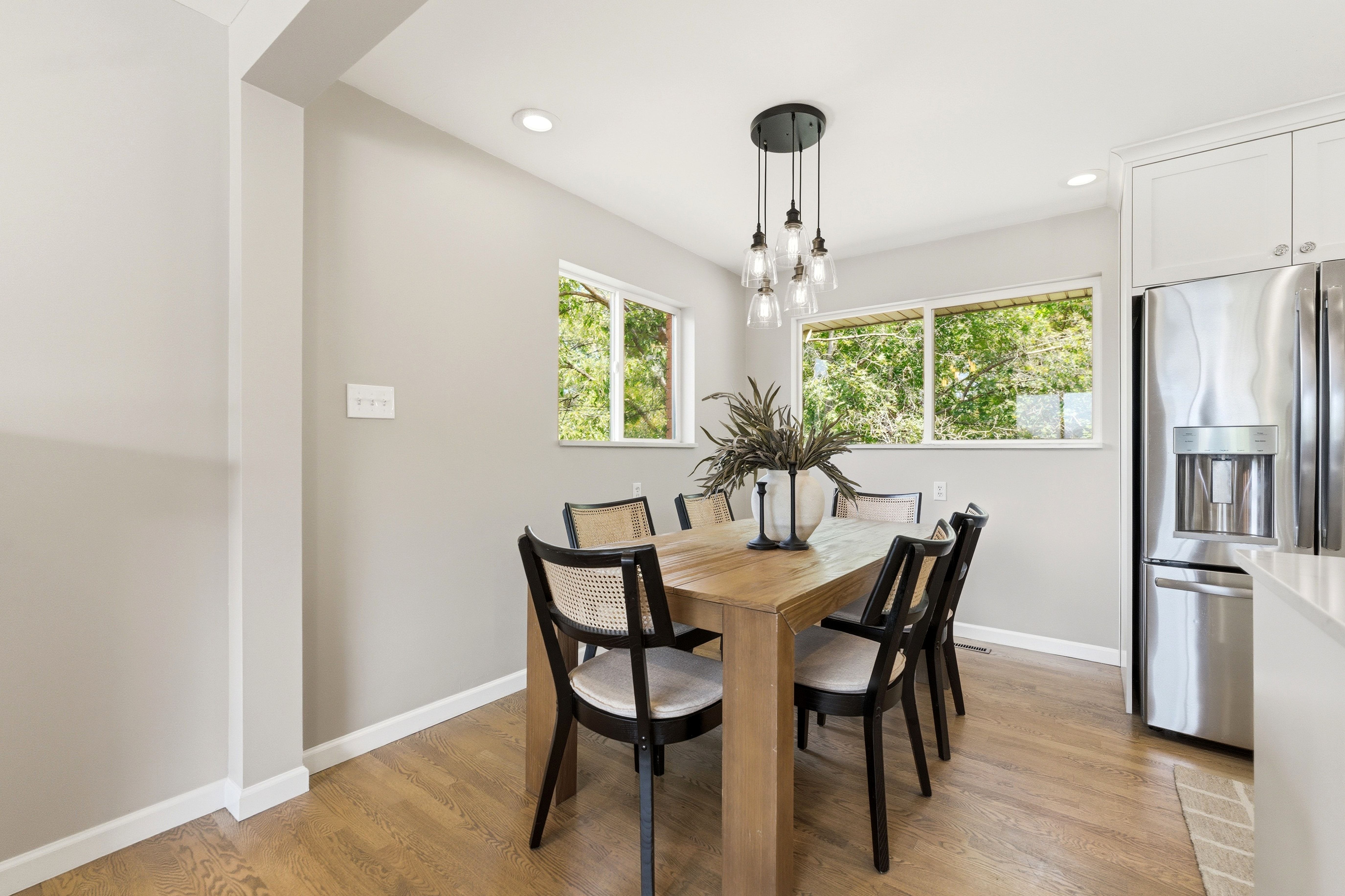 Dining area featuring wood-finish flooring and neutral wall tones