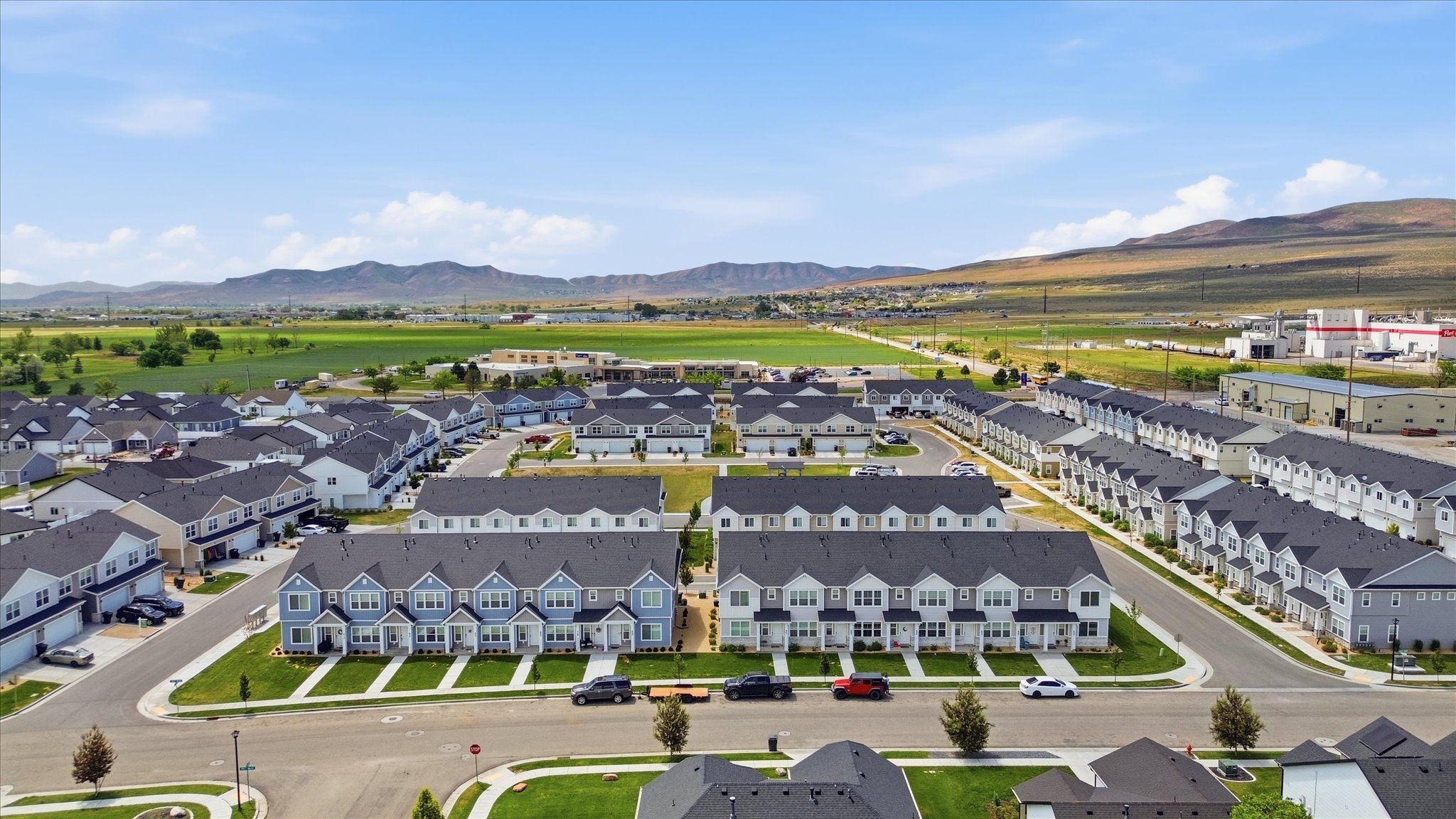Aerial perspective showcasing a community of townhomes and single-family residences
