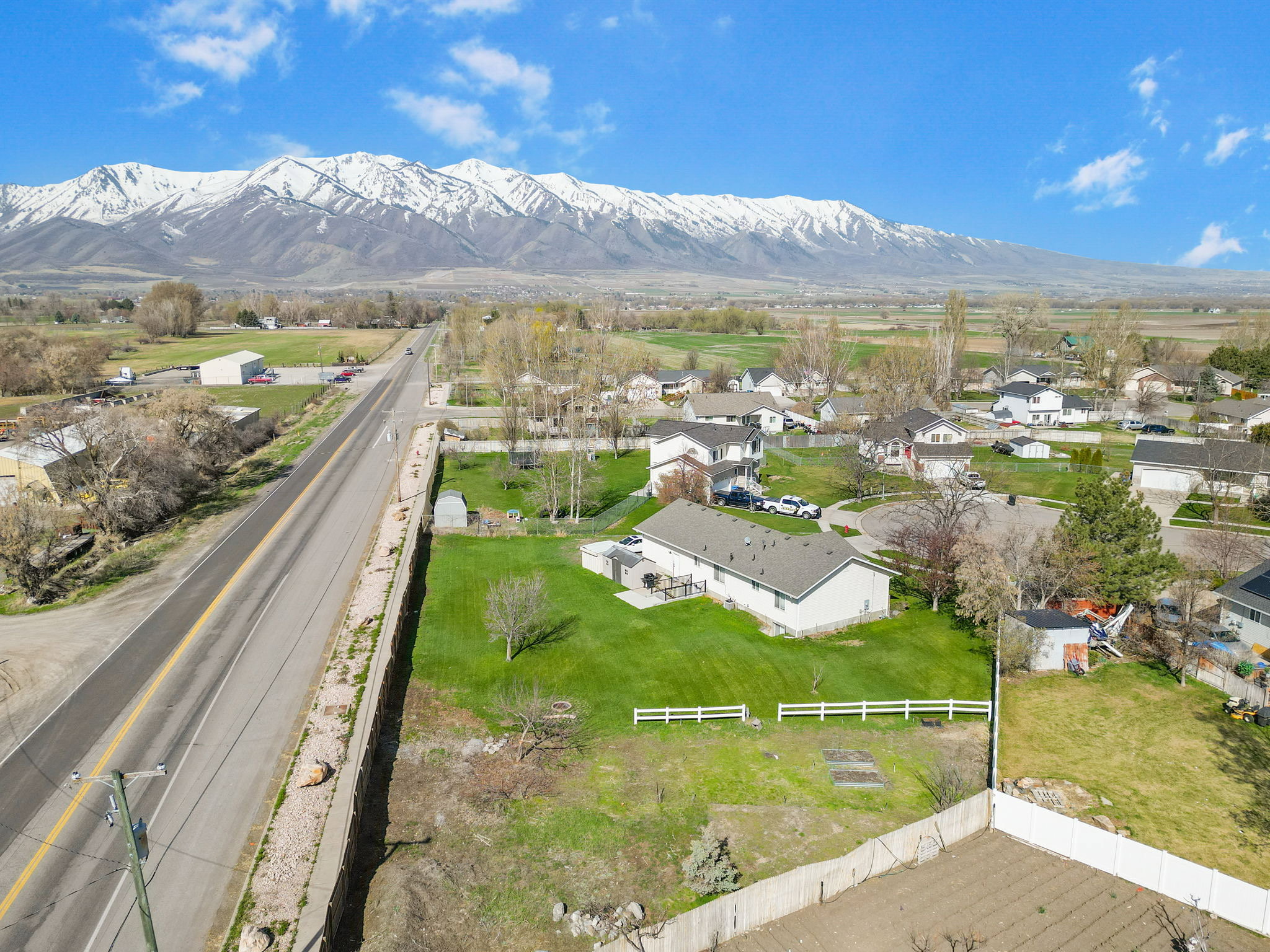 Aerial perspective showcasing the property with a vast mountain range backdrop