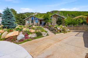 Stone-clad exterior featuring a prominent A-frame window design