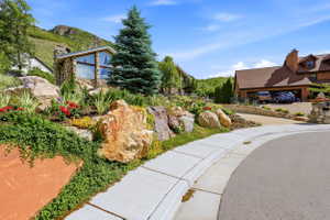 Stone exterior residence with a prominent A-frame window design