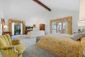Vaulted white ceilings with exposed wood beam