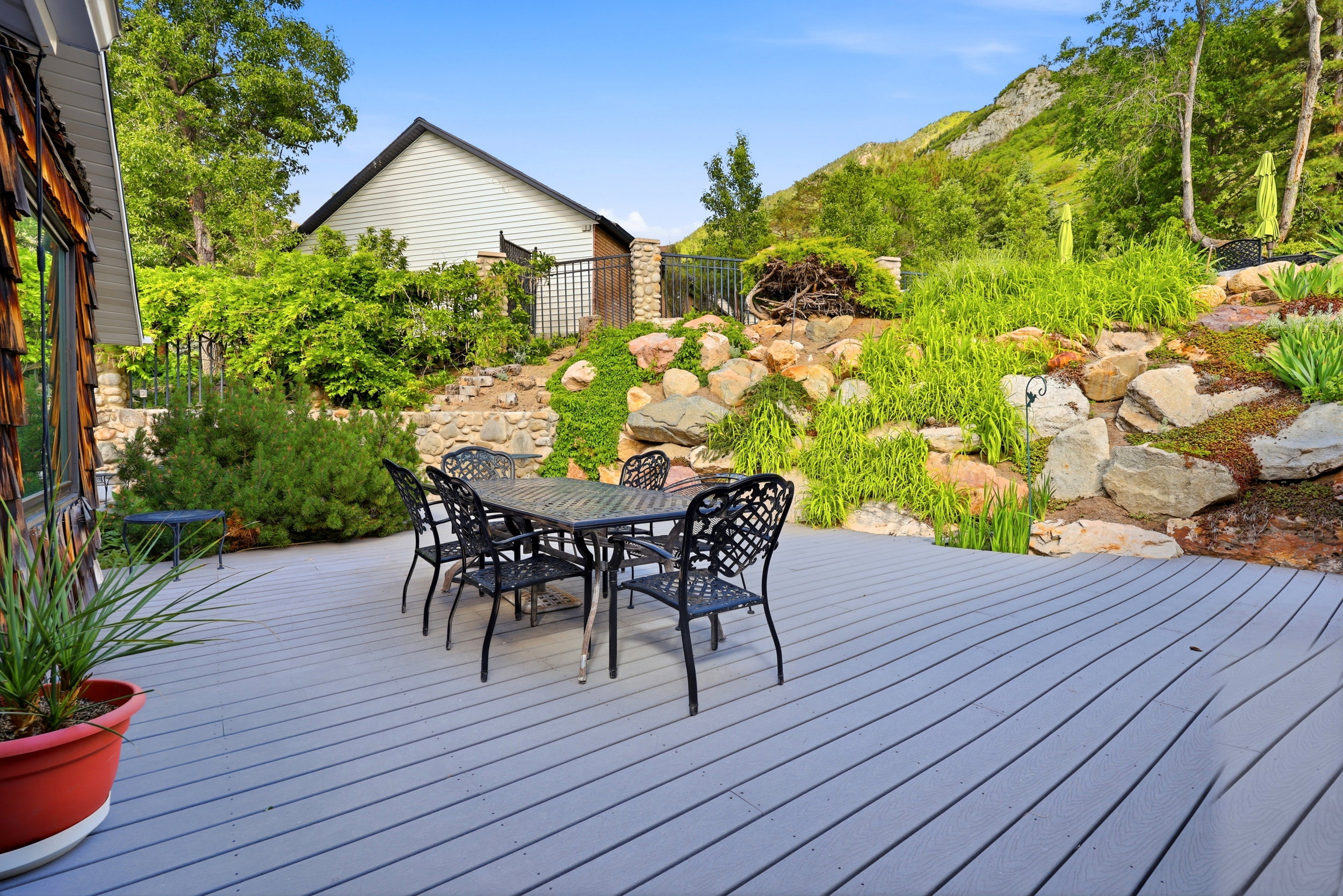 Spacious outdoor deck featuring gray composite decking