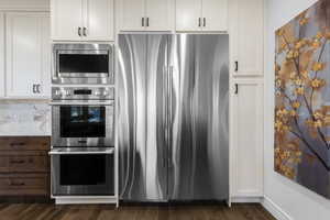 Stainless steel French door refrigerator, built-in double oven, and microwave