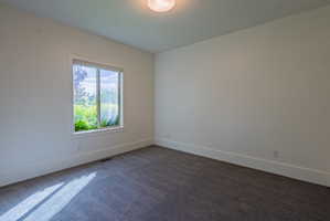 Neutral white walls and ceiling with textured gray carpeting