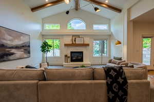 Vaulted ceiling featuring exposed beams and recessed lighting