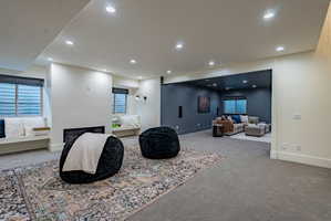 Spacious lower-level area featuring recessed lighting and plush carpeting