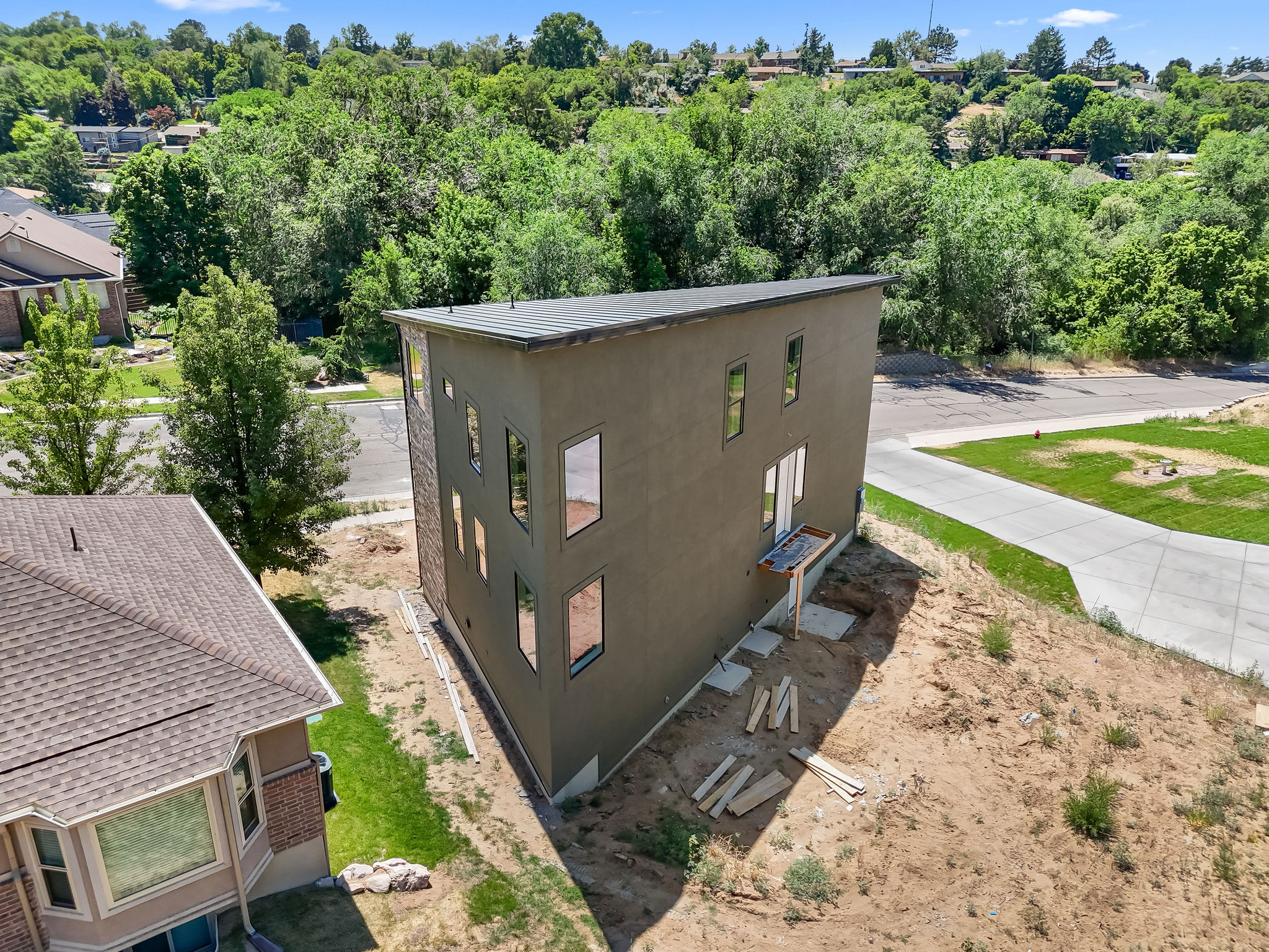 Contemporary multi-story exterior with stucco finish and a flat roofline